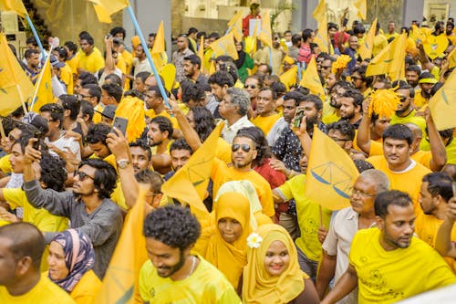 Free People Wearing Yellow Shirts Stock Photo