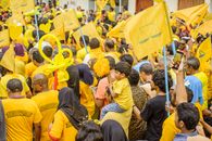 Crowd of People Wearing Yellow Shirts