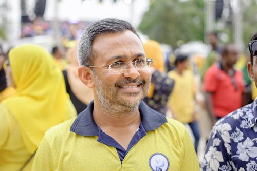 Man Smiling and Wearing Eyeglasses