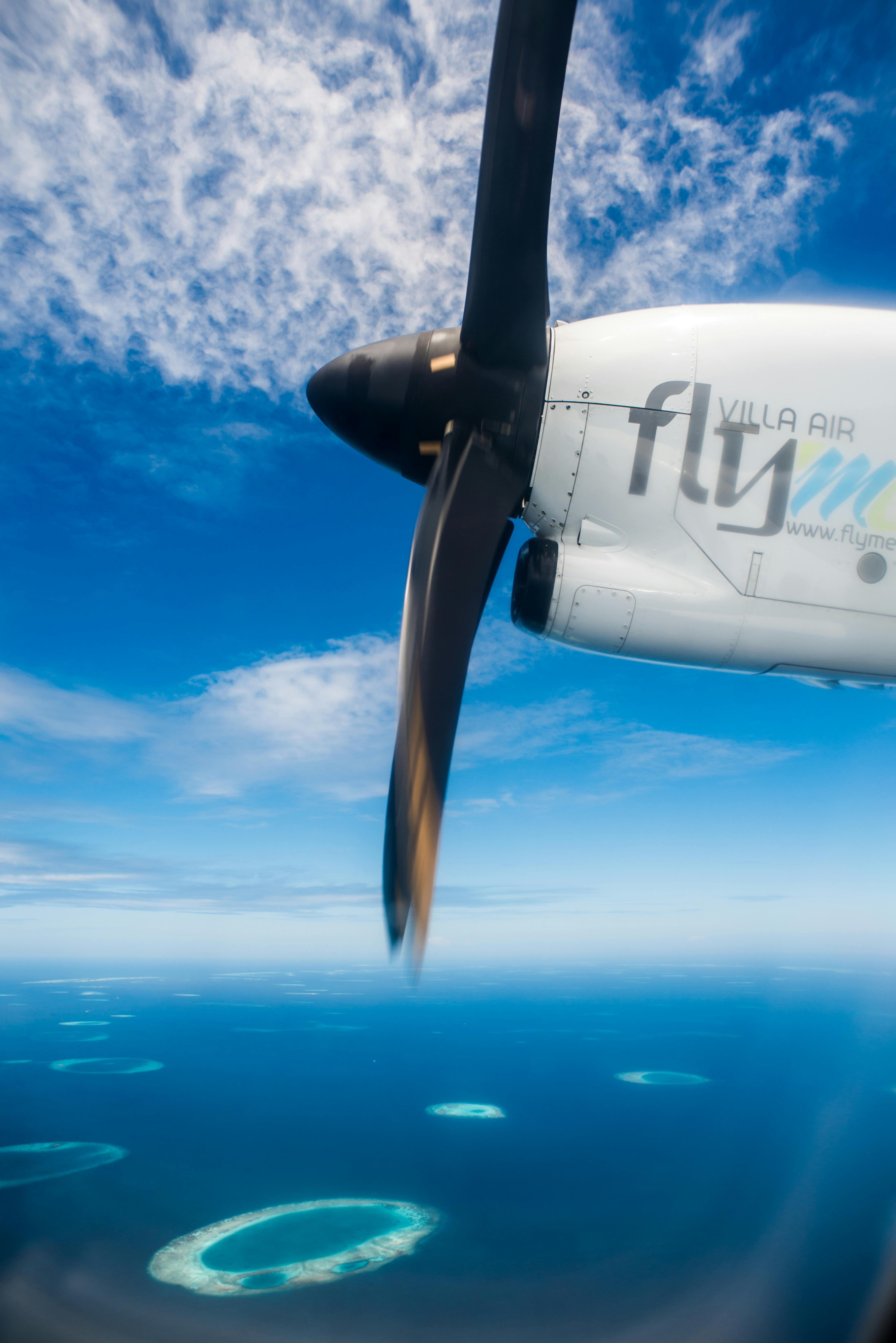 white-plane-on-sky-free-stock-photo