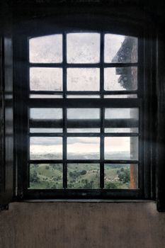 A classic window frame with a view of scenic hills and lush landscape, casting soft daylight indoors.