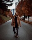 Smiling Man Walking Alone on Pathway