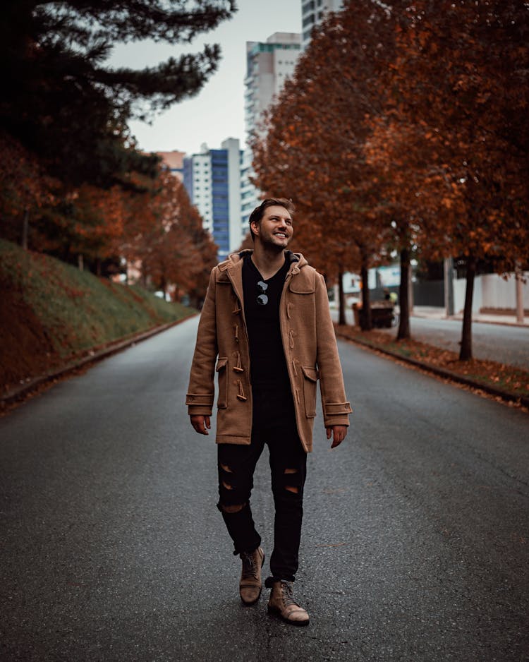 Smiling Man Walking Alone On Pathway