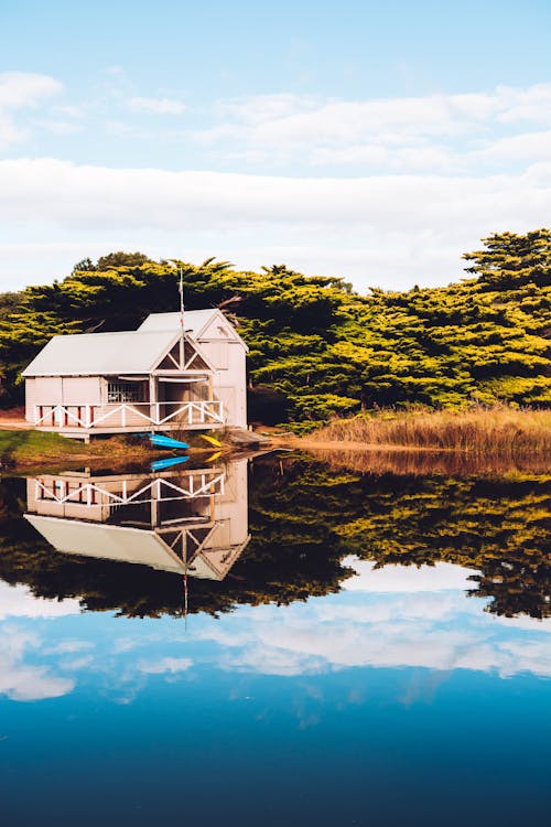 Beige Wooden Barn on Lake