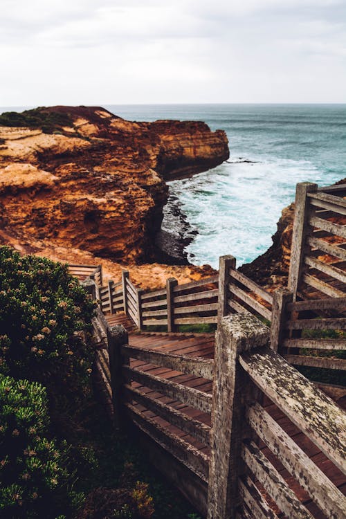 Brown Wooden Boardwalk Near Seashore