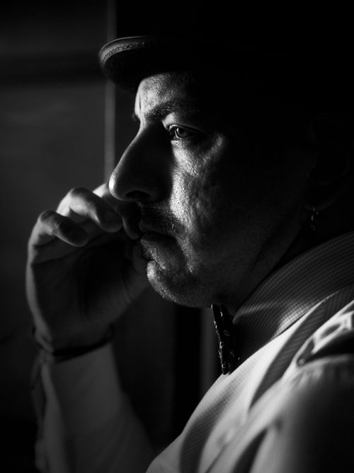 Free Black and white profile of a man with a bow tie in Buenos Aires, Argentina. Stock Photo