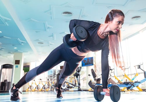 Free Woman Doing Exercise Inside Gym Stock Photo