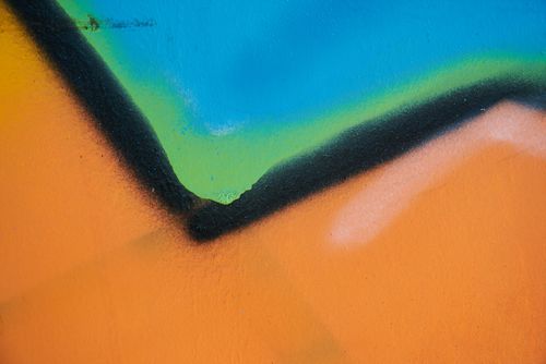 Free Close-up of vibrant abstract street art with bold colors and dynamic shapes. Stock Photo