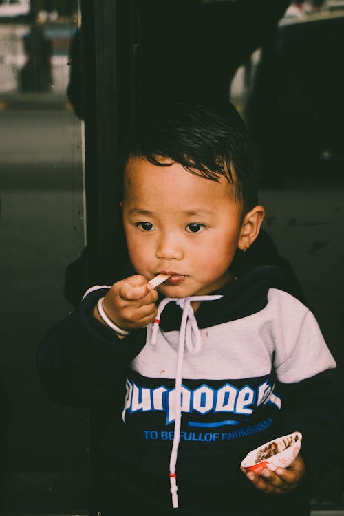 Free Boy Wearing Black and White Jacket Stock Photo