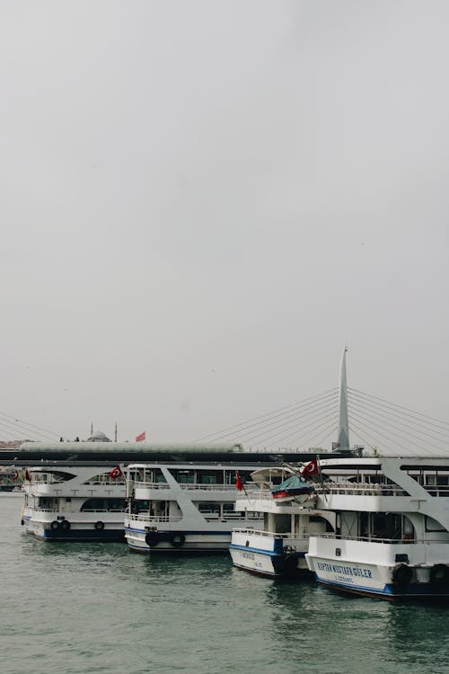 Halic Bridge behind Ferries on Sea in Istanbul