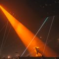 Stage lit by orange spotlights — photo by Eric Smart on Pexels