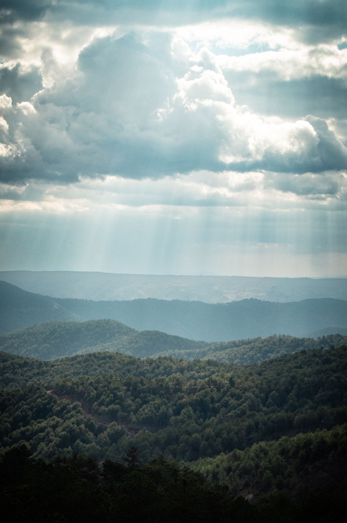 Sunbeams behind Clouds over Green Plains · Free Stock Photo