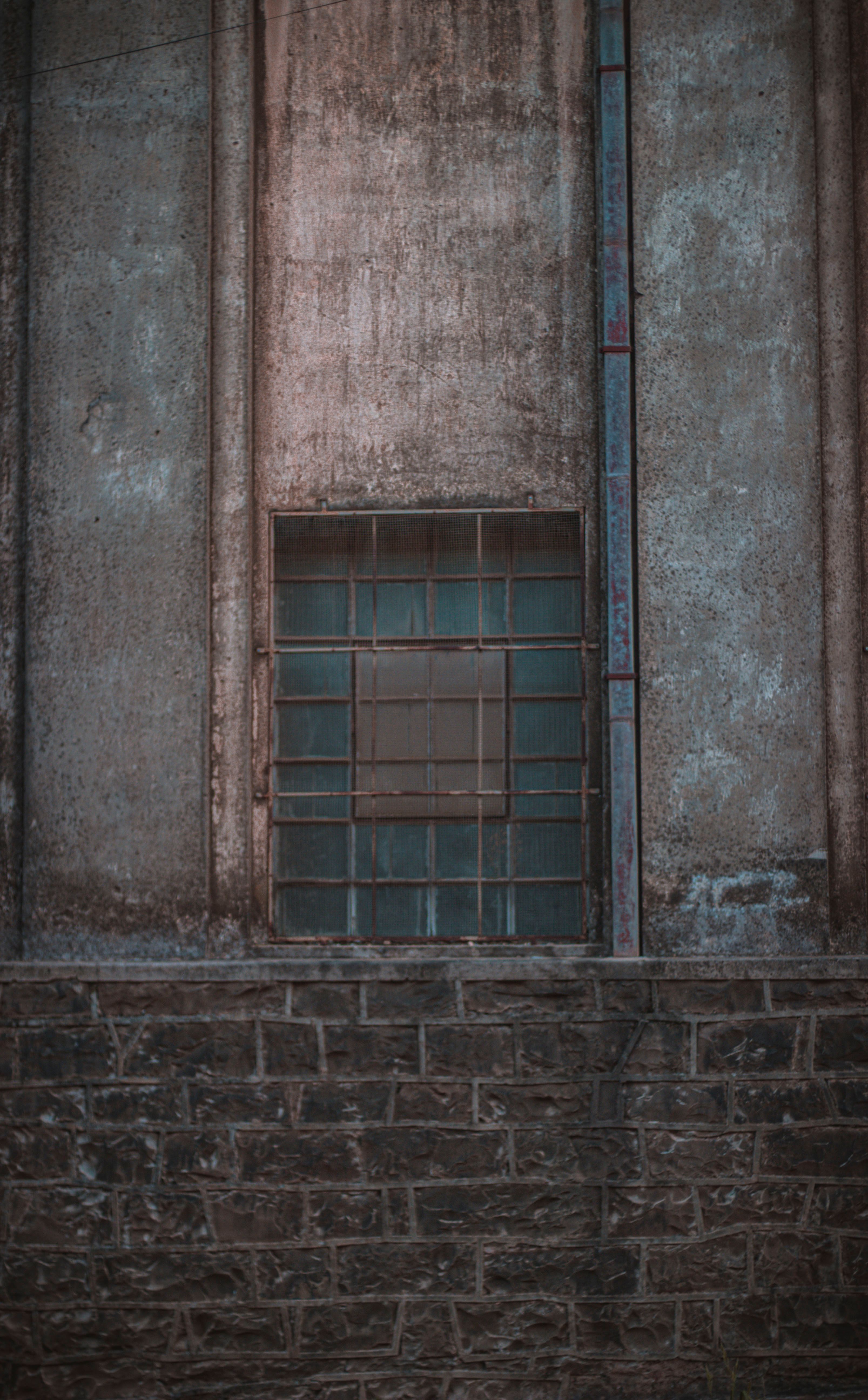 Metal Bars in Window of Abandoned Building · Free Stock Photo