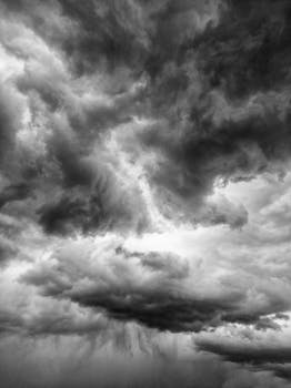 Black and white image of dramatic storm clouds building in the sky over Boise, Idaho.