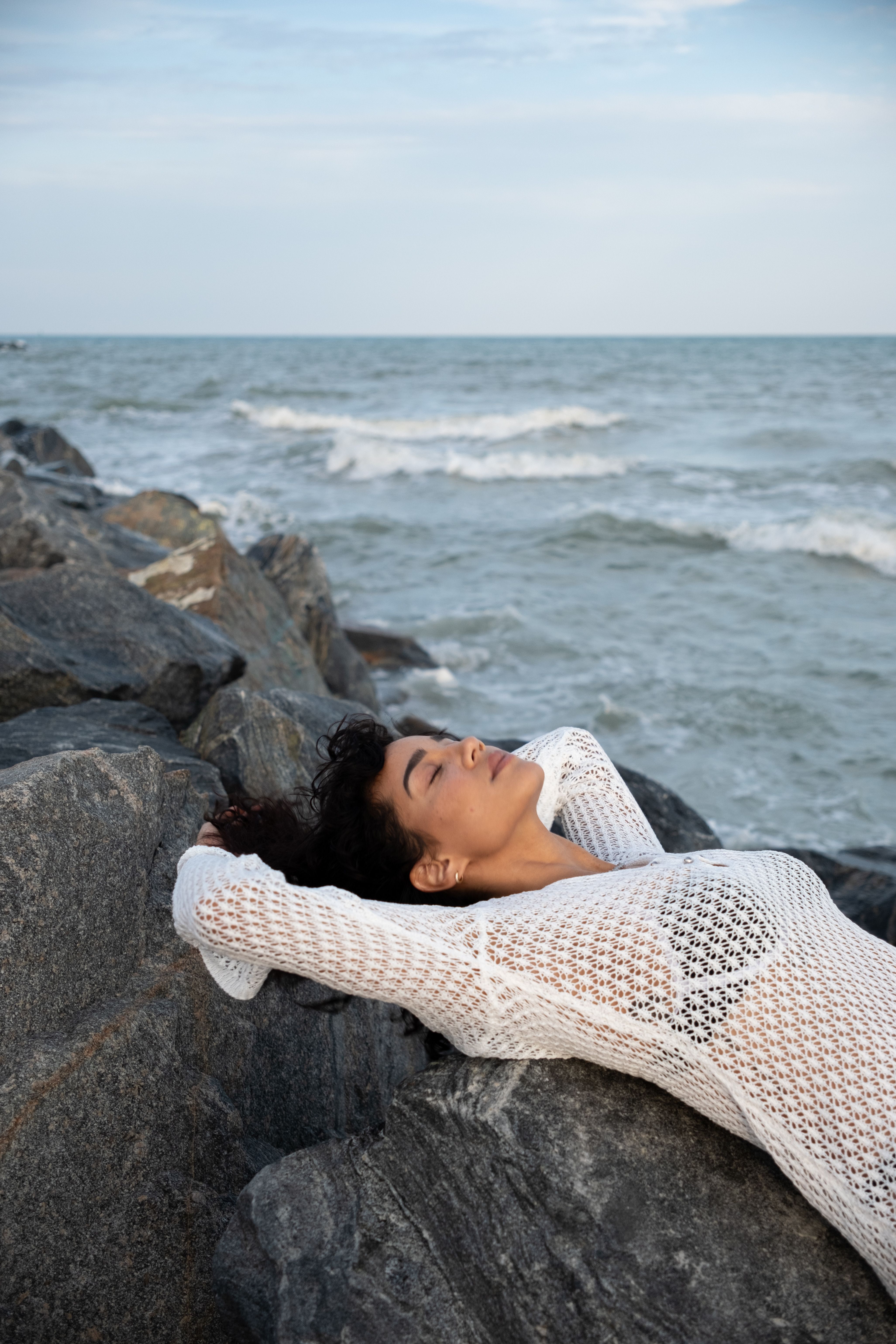 Woman Lying on Rocks · Free Stock Photo