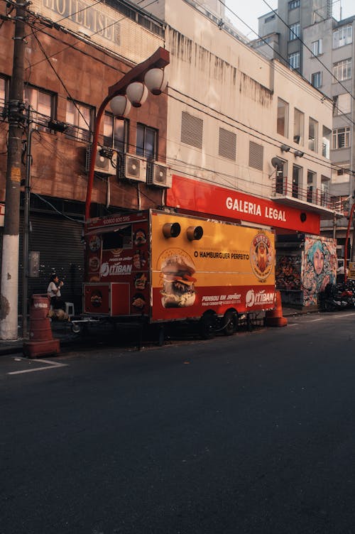 A food truck parked on the side of a street