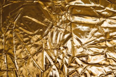Crumpled gold foil surface. Photo by Lisa from Pexels on Pexels