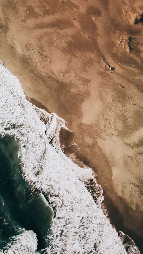 Free Stunning aerial shot of Antalya's untouched coastline with crashing waves and sandy shores. Stock Photo