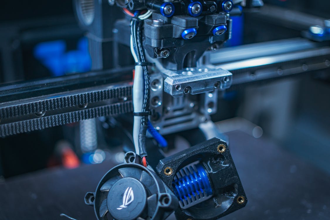 A 3d printer with a blue and black machine