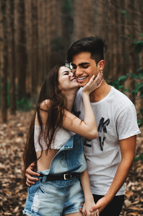 Free Woman About to Kiss the Man at the Forest Stock Photo