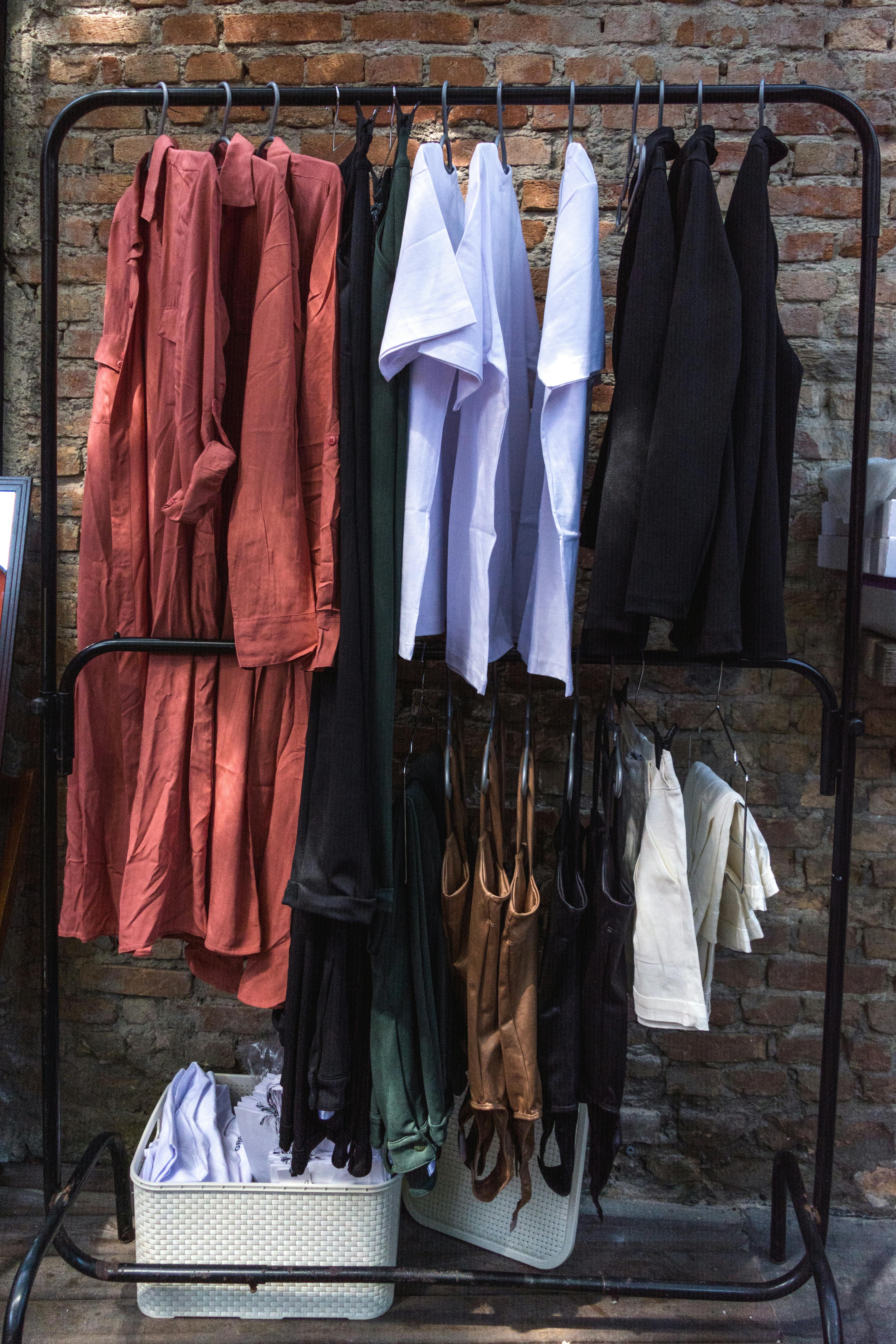 Variety of Sports Bra on Brown Wooden Clothes Hangers · Free Stock Photo