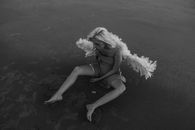 Woman Sitting on Ground