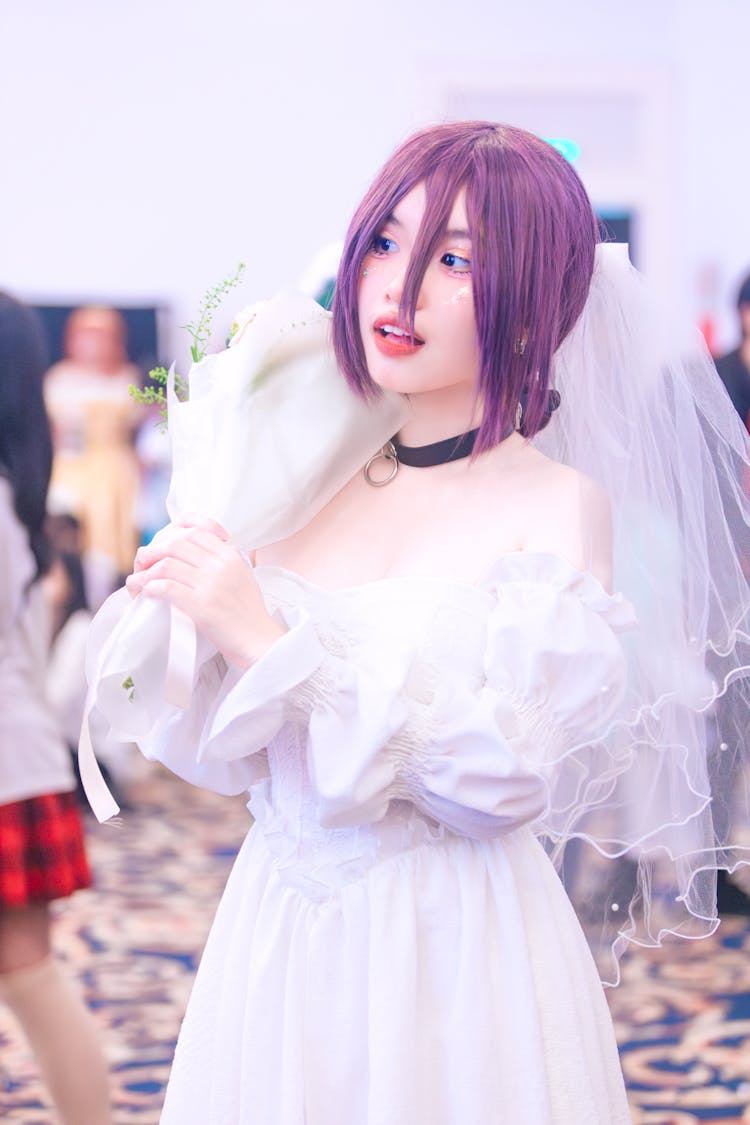 Woman Wearing Manga Cosplay Costume Holding Flower Bouquet