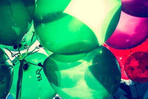 Landscape Photo Of Green and Red Balloons