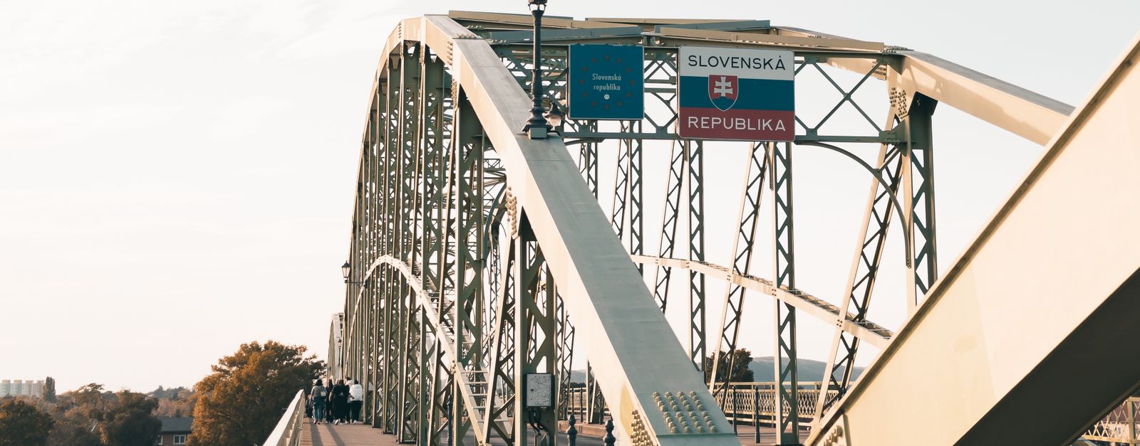 A scenic view of Maria Valeria Bridge connecting Hungary and Slovakia over the Danube River.