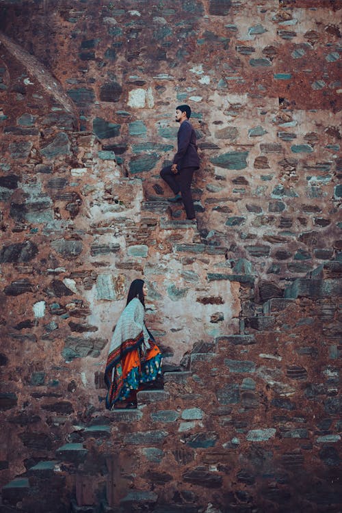 Man and Woman Walking Up the Stairs