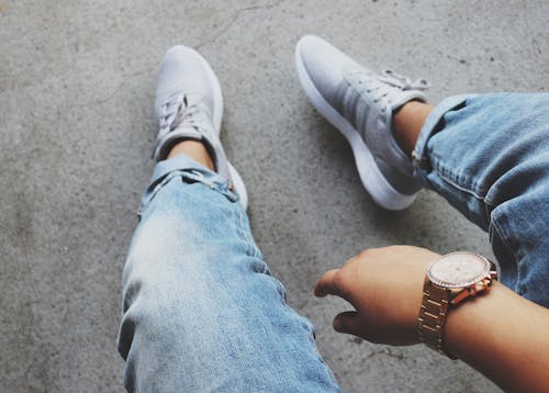 Grey Adidas Sneakers Near Blue Denim Bottoms