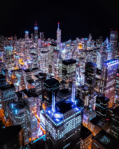 Free Aerial View Of City Buildings At Night Stock Photo