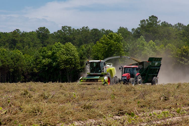 Tractors Working On Field