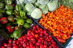 Crates of fruit and vegetables at a market stand