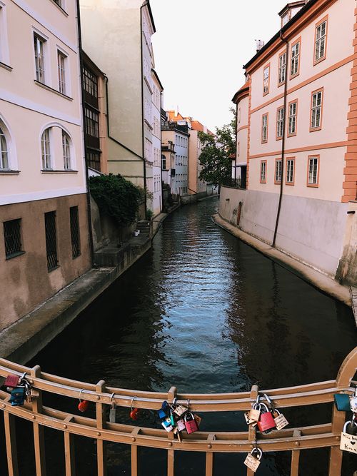 Free Charming canal scene with locks on a bridge and beautiful buildings. Stock Photo