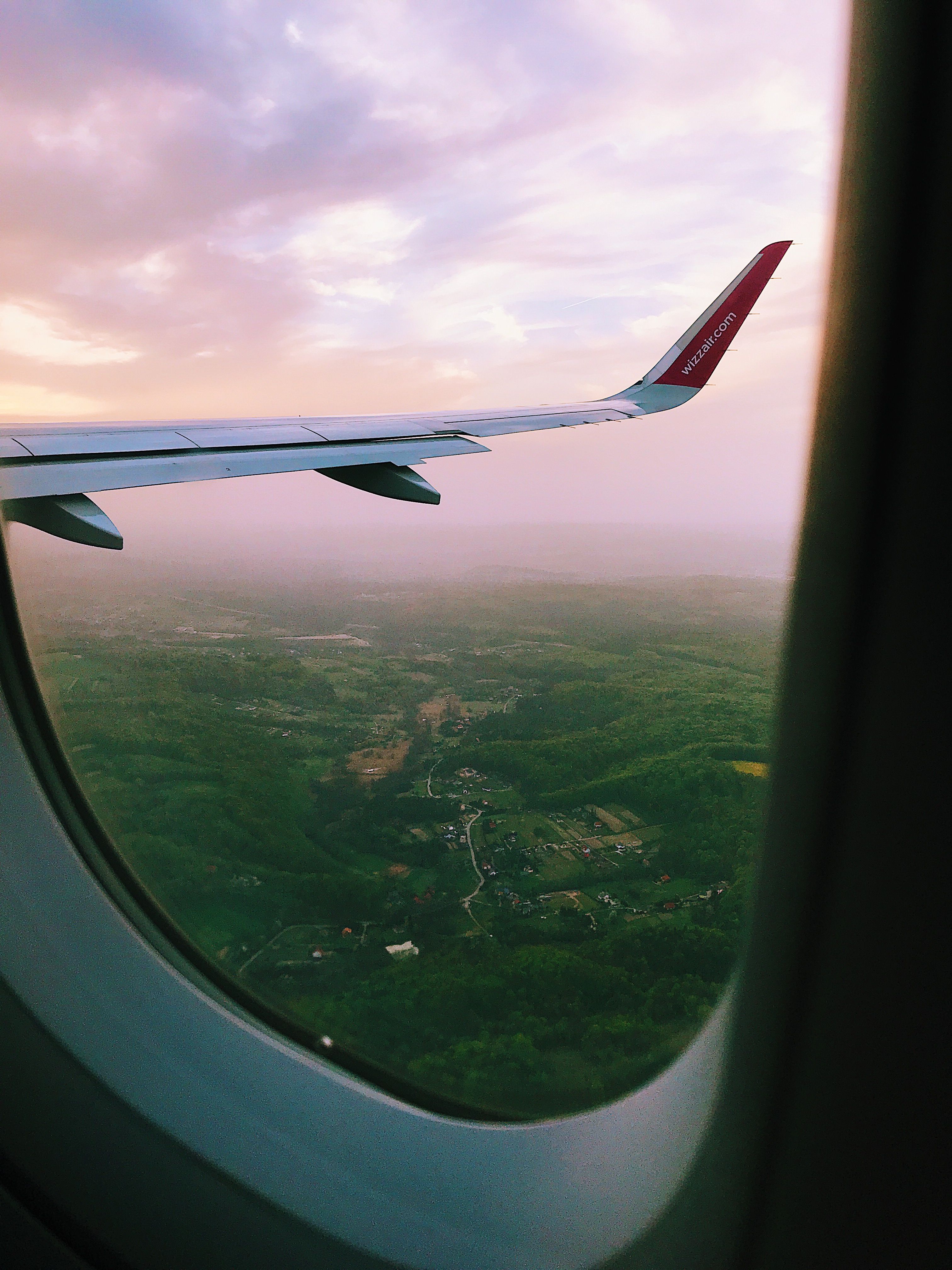 plane-window-across-bent-plane-wing-free-stock-photo