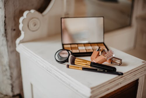 Free Make-up Brushes and Make-up Palette on Table Stock Photo
