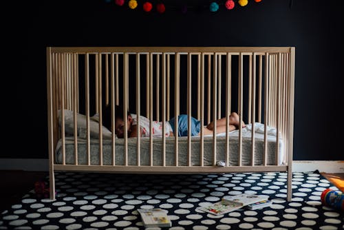 Free Toddler In A Crib Stock Photo