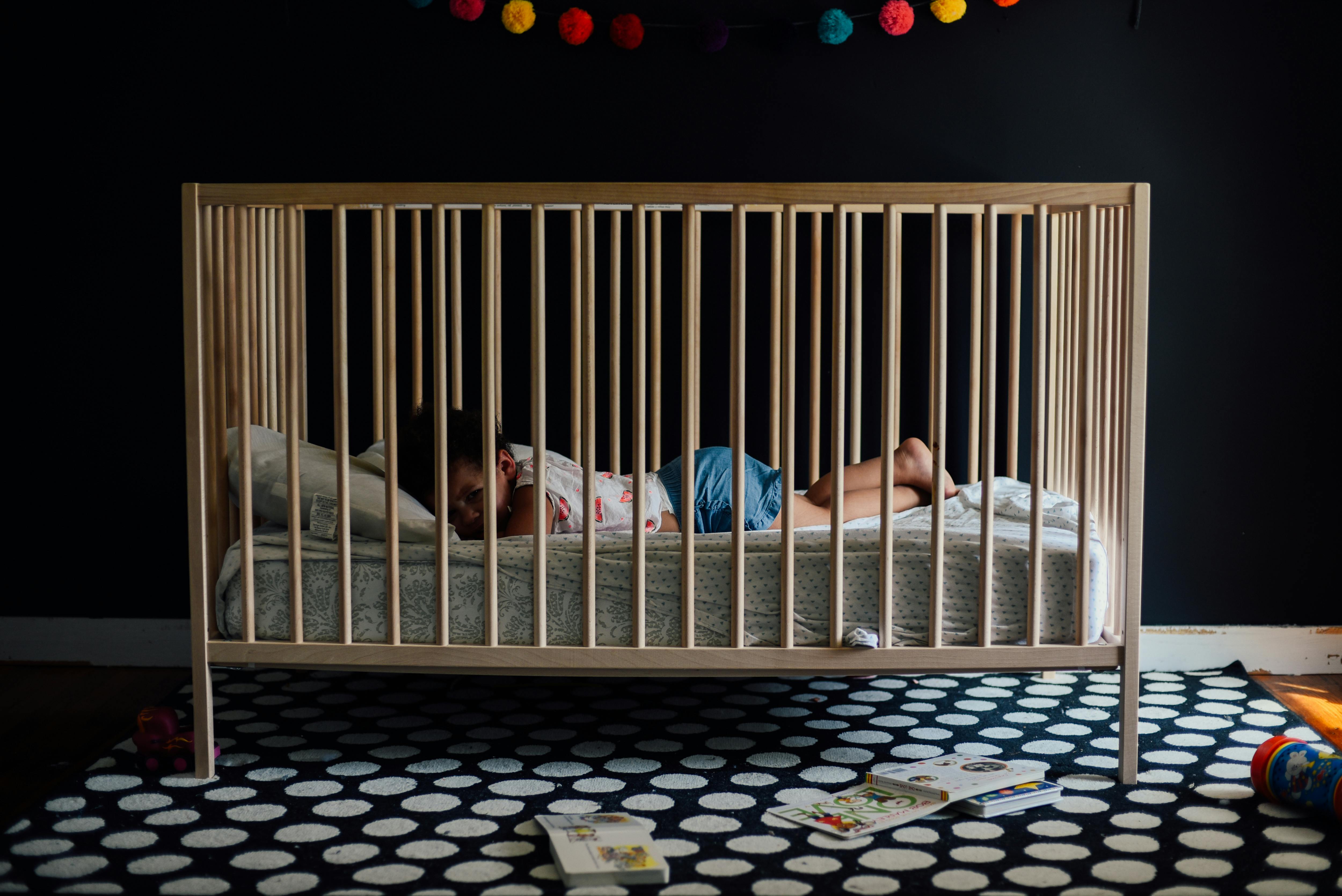 Toddler In A Crib · Free Stock Photo
