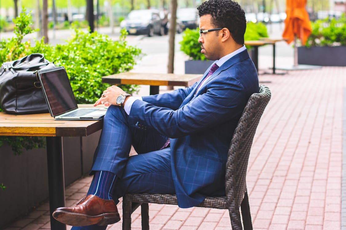 Sitting Man Wearing Formal Suit Using Laptop Computer