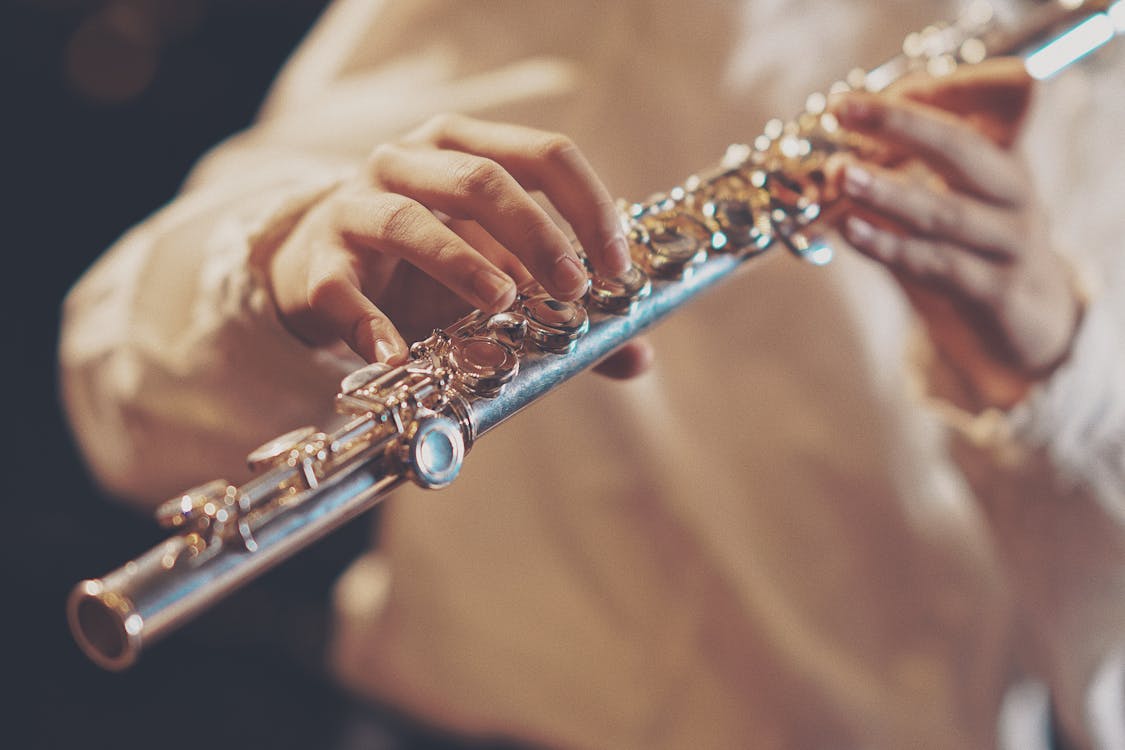 Free Person Playing Wind Instrument Stock Photo