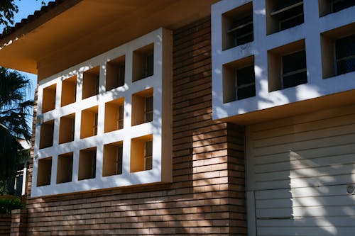 Free Brown Brick House White Multi-framed Windows Stock Photo