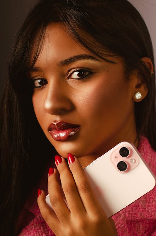 A woman holding an iphone in her hand