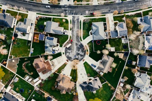 Free Aerial view showcasing a residential neighborhood in Herriman, Utah with modern architecture and green lawns. Stock Photo