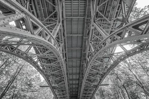Under the Bridge Greyscale Low Angle Photograph