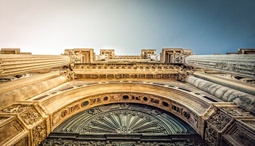 Bottom View of Vintage Arch during Daytime