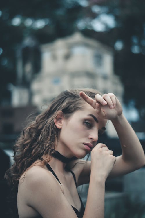 Woman Wearing Black Spaghetti Strap Top