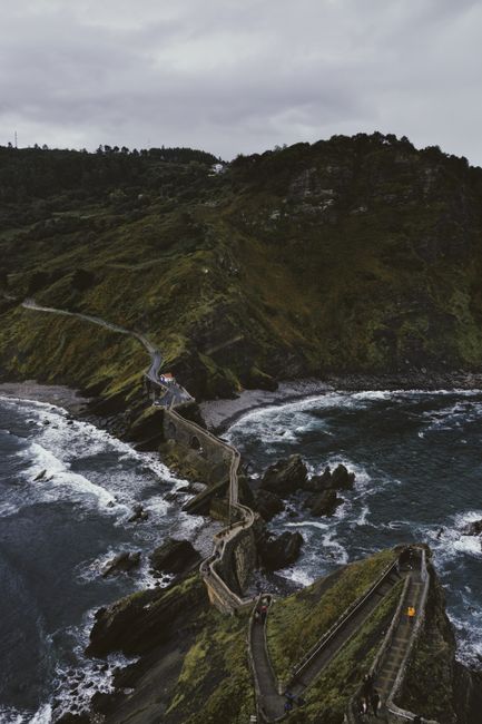 Explore the rugged coastal path leading to San Juan de Gaztelugatxe, a captivating travel destination.