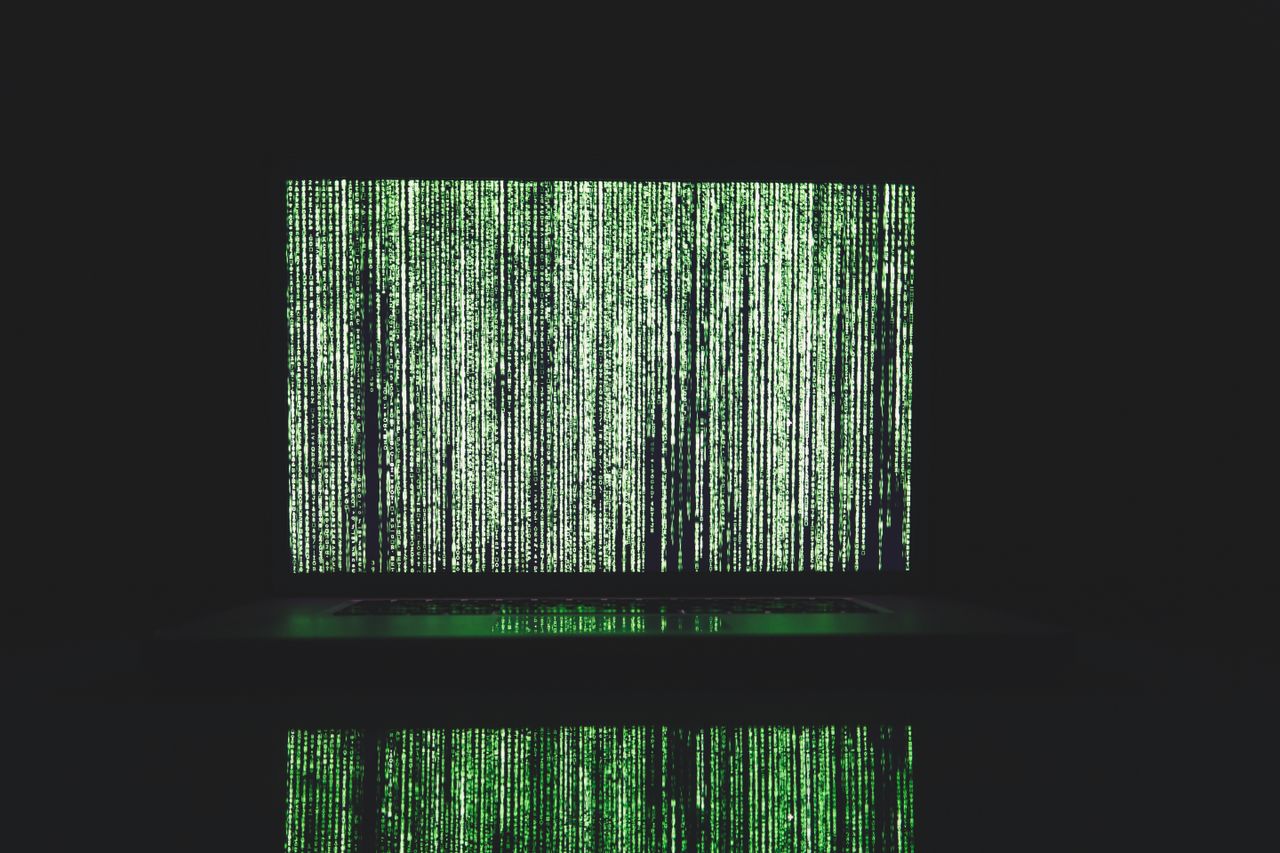 abstract depiction of green matrix code on a computer monitor