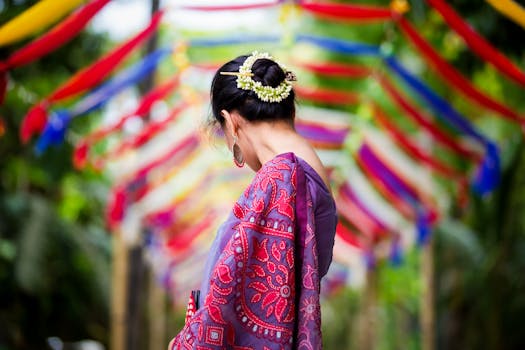 A woman in traditional attire at a vibrant outdoor festival in Bangladesh.
